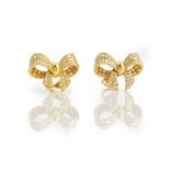 A pair of 18ct gold and diamond earclips, each designed as a ribbon tied bow,