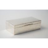 A silver rectangular table cigarette box, wooden lined within, with two adjustable divisions,