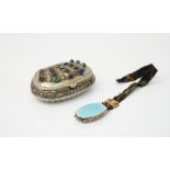 A European shaped oval hinge lidded snuff box, with scroll and partly fluted decoration,