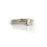 An 18ct white gold and diamond single stone ring, mounted with a circular cut diamond,