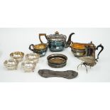 A Regency style electroplate three piece tea service, rounded oblong, on bun feet,