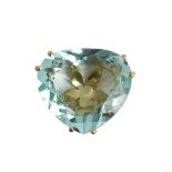A gold and aquamarine single stone pendant, claw set with a curved triangular cut aquamarine.