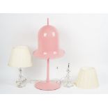 A Lolita pink table lamp, with a pivoting shade, and a pair of hexagonal table lamps,