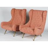 A pair of vintage Zanuso armchairs with tubular metal frames, upholstered in cream,