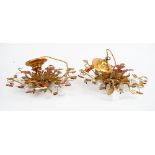 A pair of gilt metal light fittings of a leafy floral design, 38cm wide x 15cm high.