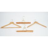 A large collection of wooden coat hangers, in various styles (qty).
