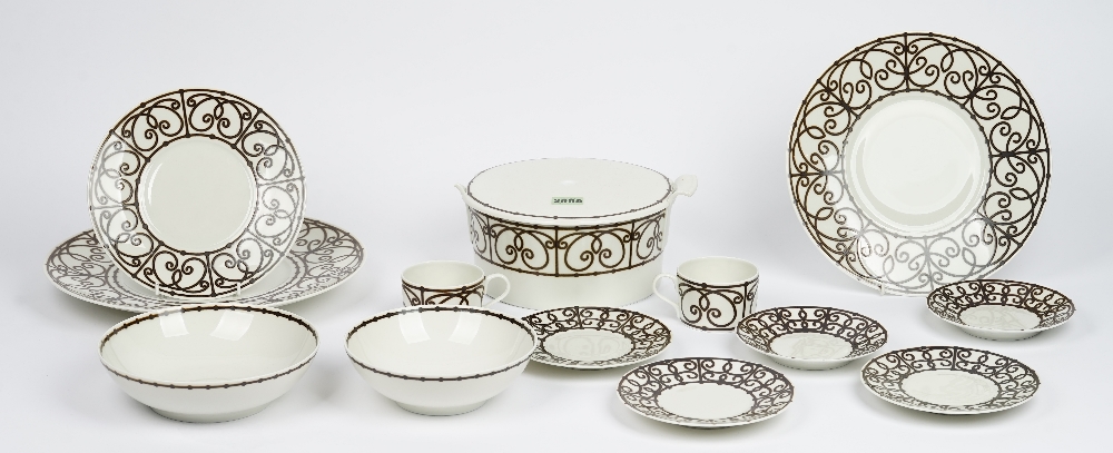 A Limoges J L Coquet tea and dinner service, essentially for eight persons,