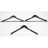 A large collection of black finish wooden coat hangers, varying styles (qty).