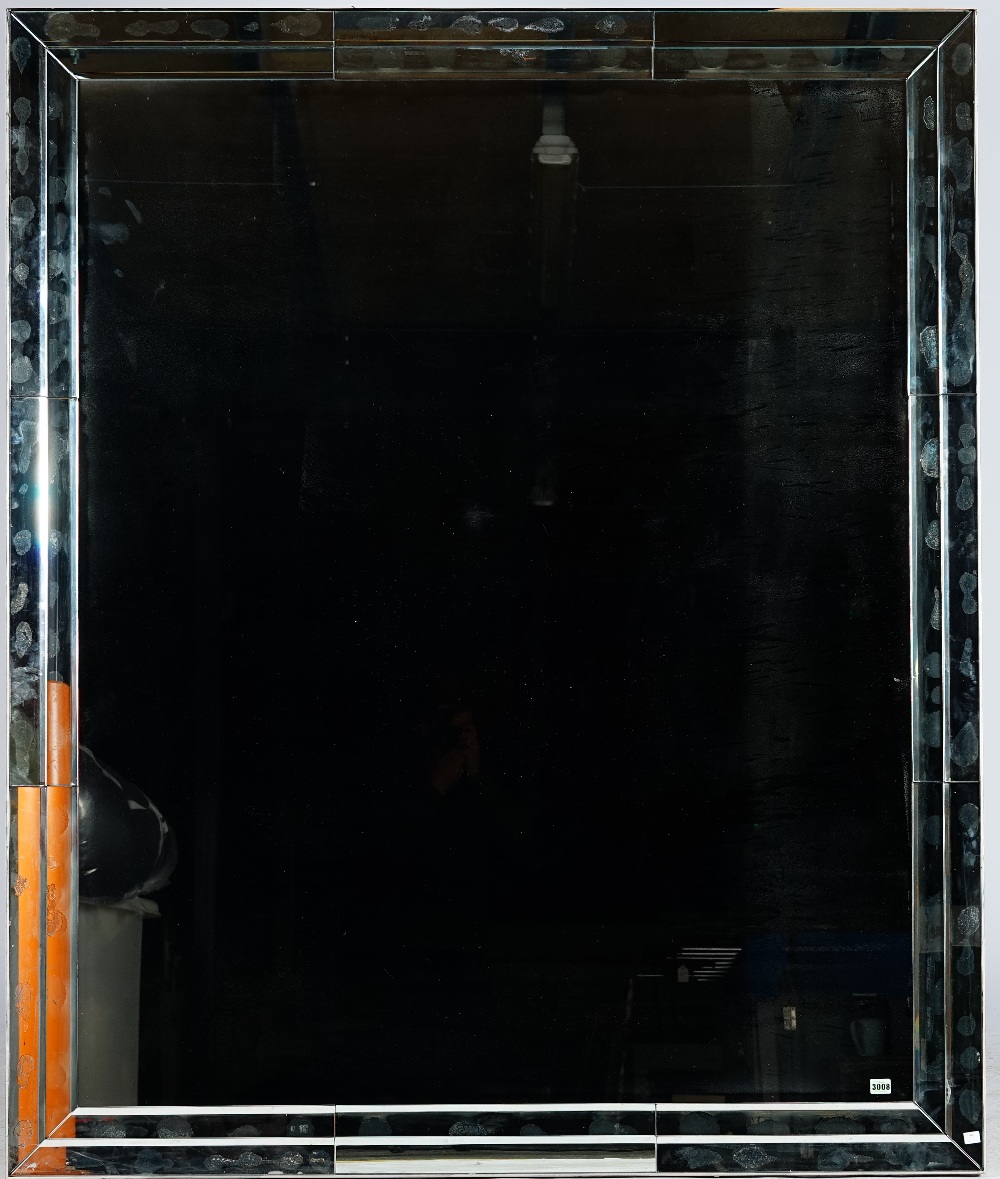 A large rectangular marginal wall mirror,