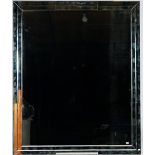 A large rectangular marginal wall mirror,