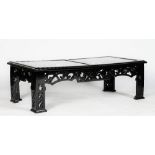 A black high gloss rectangular low cocktail table, in Chinese style,
