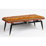 A mid century ebonised bench,