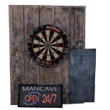 A 'Mancave' sign, illuminated 'Open 24/7' and a dartboard (2).