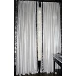 A pair of white silvered woven curtains, with black and white bobbles. 115cm wide x 315cm long.