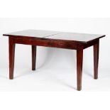 A hardwood dining table, with extending rectangular top, on square tapered legs,