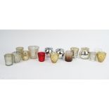 A large collection of West Elm mercurial glass tea light holders and various others in coloured