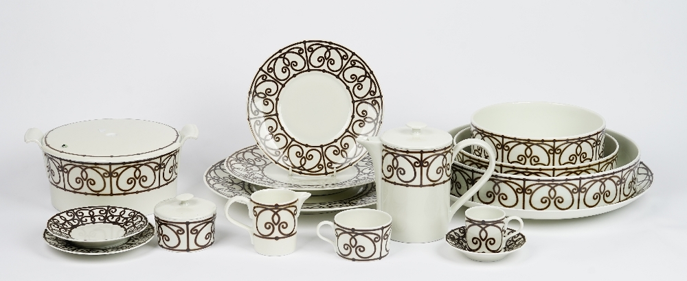 A Limoges J L Coquet tea and dinner service, essentially for eight persons,