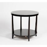 A John Widdicomb circular two-tier mahogany side table, with a rich espresso finish, 61cm wide.