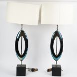 A pair of Manhattan sculpted table lamps, with oval silk shades (2).