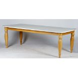 A contemporary kitchen table, with white painted rectangular top, on turned oak legs,