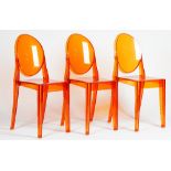 A set of eight Kartell orange lucite 'Ghost' chairs, S + ARCK by Victoria Kartell,