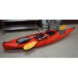 A Dagger Axis Elite 10.5 red kayak.