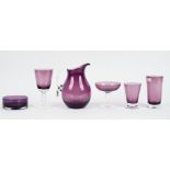 A suite of William Yeoward amethyst coloured glassware for six persons, the wine glasses only five,