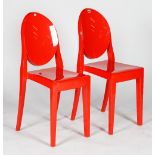 A pair of red chairs, Victoria Ghost design S+ARCK by Kartell, 39cm wide x 91cm high, (2).