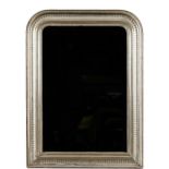 An arched top mirror in moulded distressed silvered wood frame, 76cm wide x 104cm high.