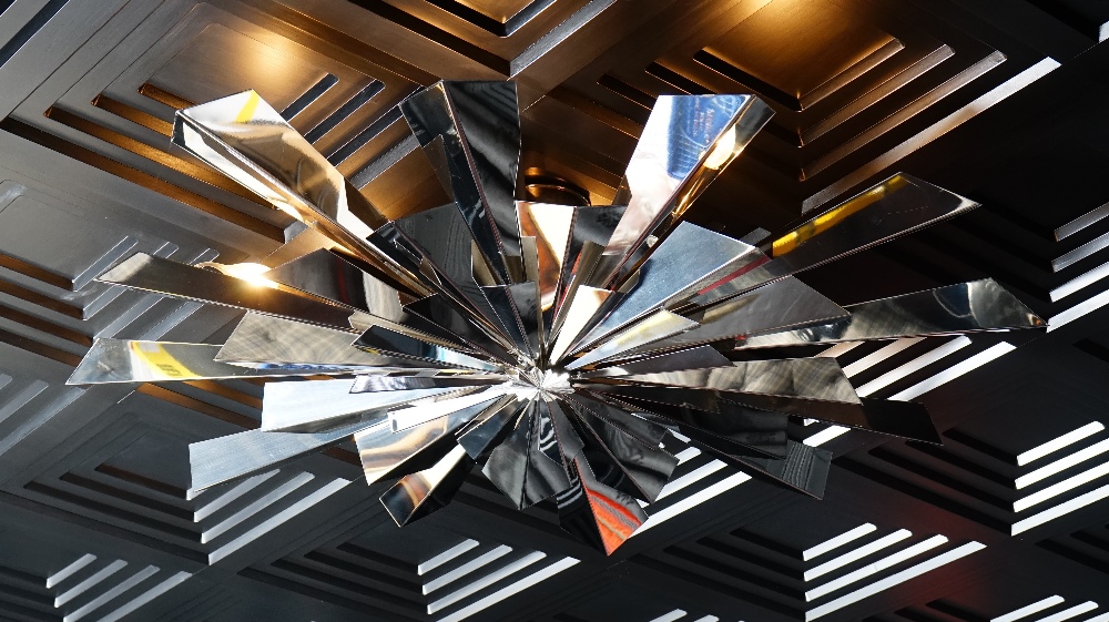 A contemporary chromium starburst light fitting, 120cm diameter. - Image 2 of 2