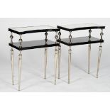 A pair of black high gloss two-tier end tables, with concave sided mirror inset tops,