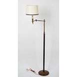 A brass floor standing adjustable lamp, 122cm high.