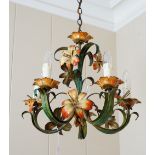 A wrought metal five light chandelier, polychrome painted with scrolling flower head branches,