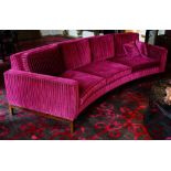 A contemporary curved three seat sofa,