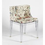 A Madamoiselle chair by Kartell, with clear lucite frame, upholstered in Moschino fabric,