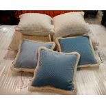 A group of cushions including four in white ribbed material (qty).