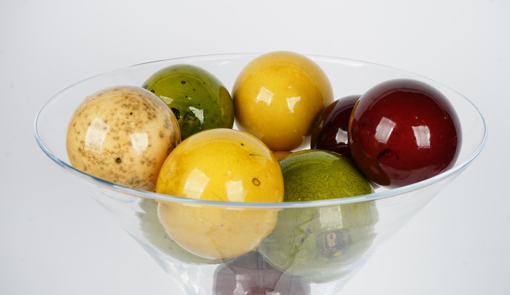 A tall contemporary glass goblet containing a collection of faux marble balls and three smaller - Image 2 of 2