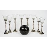 A set of eight John Lewis tea light holders, a contemporary black glass vase,