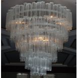 A contemporary glass chandelier, six tier, with waterfall effect, 100cm drop.