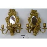 A pair of ornate cast gilt-metal Girandole Mirrors, each with three-branch candleholders,