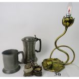 An Arts & Crafts brass table lamp in the form of water lillies and lillypad, 2 pewter tankards,