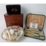 Two Japanese lacquered boxes, a collection of seashells, and a travelling vanity set,