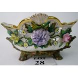 A 19th century porcelain basket, applied with realistic flowers,