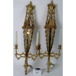 A pair of decorative Neo Classical Revival wall lights,