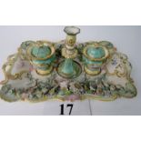 A pretty 19th century porcelain desk stand, incorporating a candleholder and 2 covered pots,