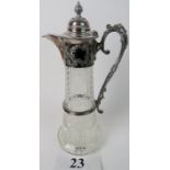 A late 19th/early 20th century silver plated mounted cut glass claret jug,