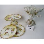 A 19th century continental porcelain pedestal bowl applied with realistic flowers,