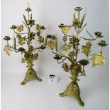 A pair of highly decorative 19th century gilt-metal candelabra, cast throughout with grapes, vines,