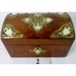 A good quality Victorian walnut tea caddy applied with brass and bone decoration,