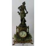 An ornate 19th century French bronzed-metal, gilt-metal, and green onyx mantel clock,